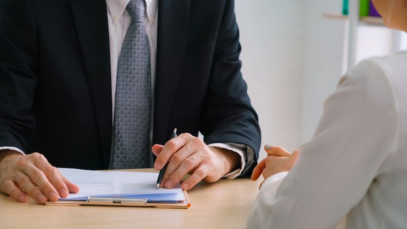 The manager shows the employee the targets on a report