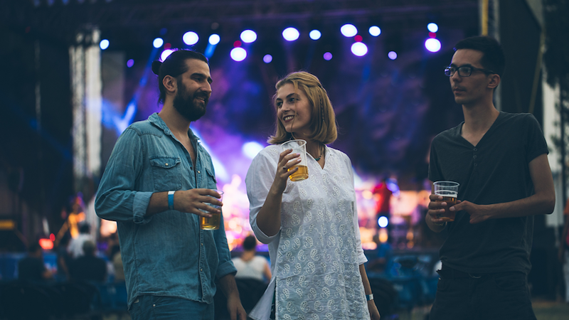 People making friends at concert