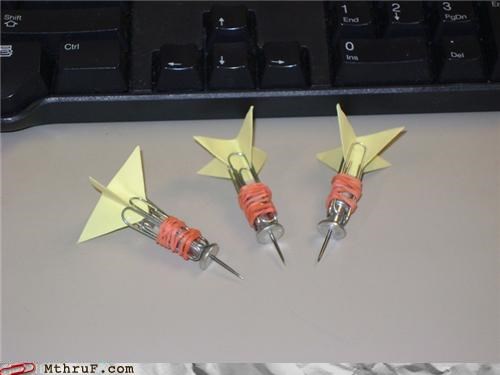 arms race,awesome co-workers not,boredom,busted,creativity in the workplace,cubicle boredom,cubicle rage,darts,deadly,hardware,ingenuity,missiles,osha,painful,pins,projectiles,rage,sass,screw you,sharp,tacks,Terrifying,thumb tacks,thumbtacks,warfare,weapons,work smarter not harder,youll-shoot-an-eye-out