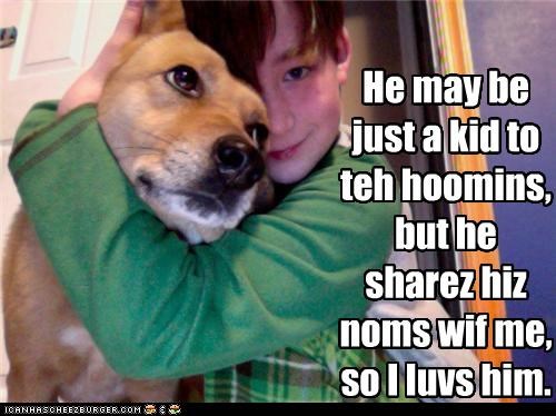 He may be just a kid to teh hoomins, but he sharez hiz noms wif me, so I luvs him.