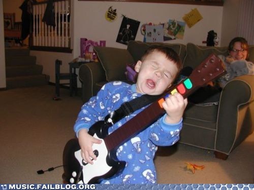 Someone Give This Kid a Real Guitar
