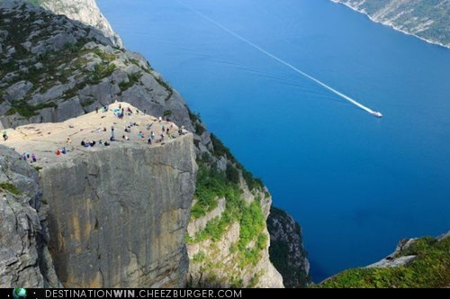 A Long Way Down at the Cliff of Preikestolen, Norway 