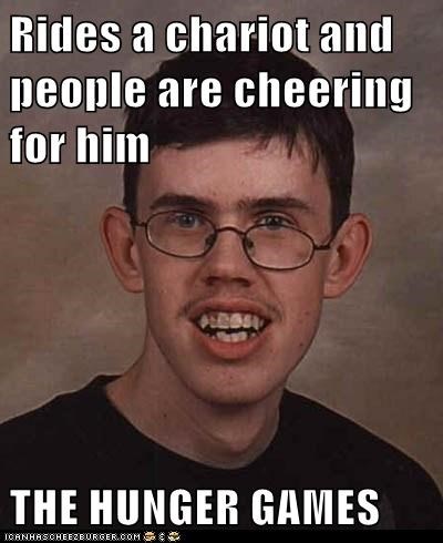 Rides a chariot and people are cheering for him   THE HUNGER GAMES