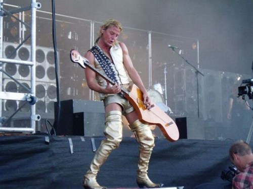 Shouldn't He Have a Monkey on His Shoulder Playing the Small Guitar End?