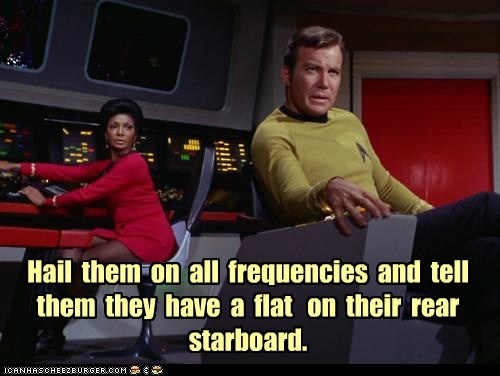 Hail  them  on  all  frequencies  and  tell them  they  have  a  flat   on  their  rear starboard.