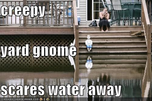 creepy yard gnome scares water away