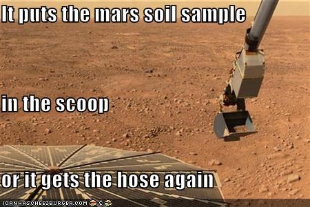 It puts the mars soil sample in the scoop or it gets the hose again