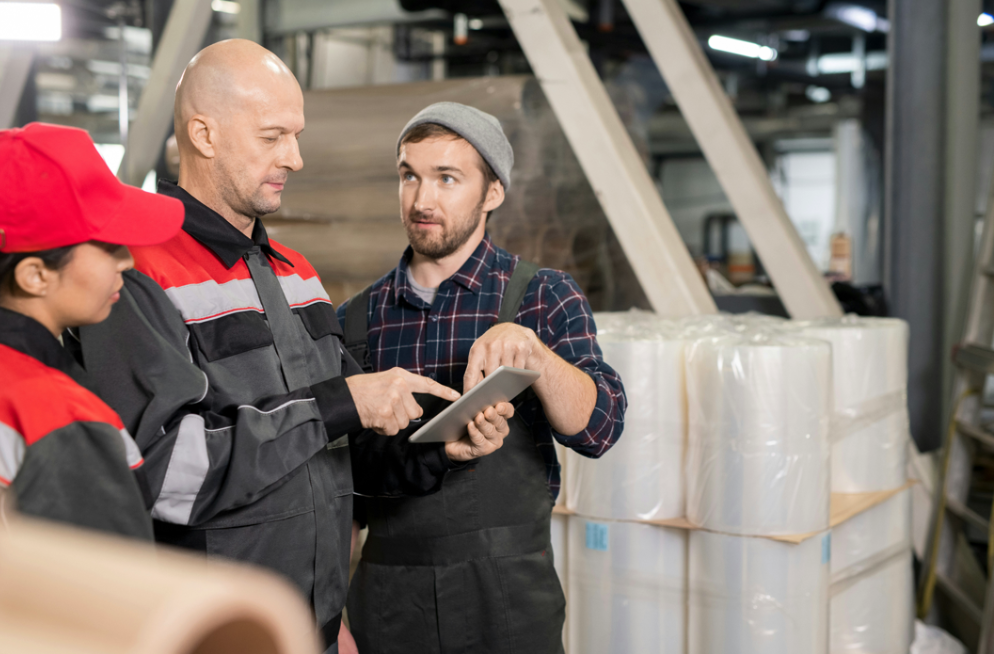Factory management holds a meeting to report record profits and tell ...
