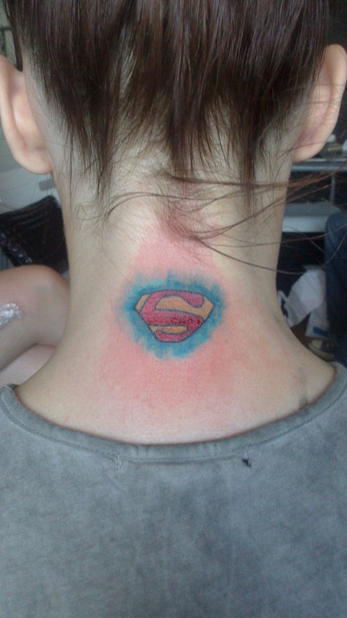 superman logo tattoo on neck