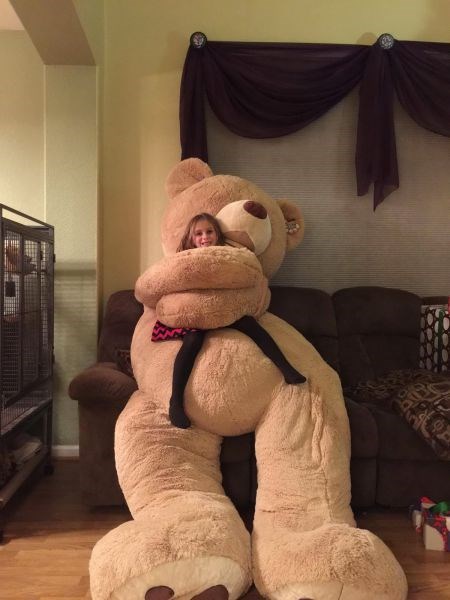 hugging giant teddy bear