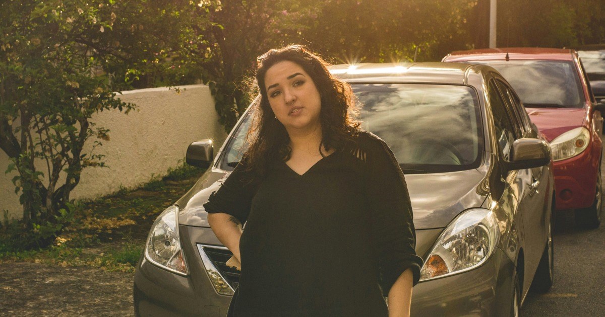 Neighbor parks two cars in front of residents' front door and refuses to move either, leading residents to report her unused car as an unregistered vehicle