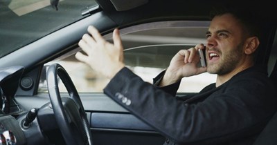 Driver honks at neighbor for using the bus stop in front of his house while he's leaving for work: 'The bus is blocking him in.'