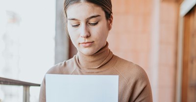 Resigning employee refuses to sign a “separation agreement,” demanding $5,000 per negative online post, and her firm threatens to withhold $2,200 in earned PTO if she doesn’t comply