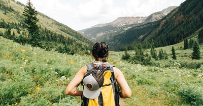 Woman gets invited to a hike by her friends, only to discover it was not what she was told. Everyone appears with utilities and then acts as if they had explained how it was going to be: 'They show up on bikes.'