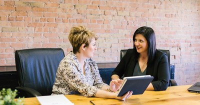 Boss tells employee who works 65-70 hours/week to take on community service instead when she asks for a raise