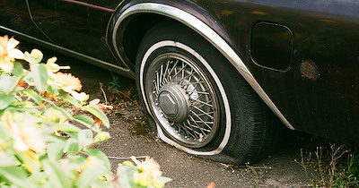 Guest tries to enter a closed campground to park their car, and instead they end up blowing their tires with the spikes, now they are upset the front desk won't fix it: 'They were SHOCKED that I said they needed to figure it out themself'