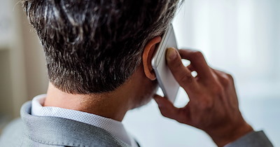 Manager aproves employee's PTO, insists that he be on line anyway, and gives the employee the cold shoulder when he sets the boundary: 'That's how it works here' 