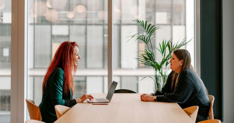 An employee meeting with her manager