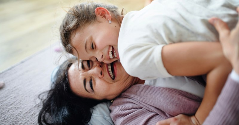  Title Description A grandma and granddaughter play on the floor together