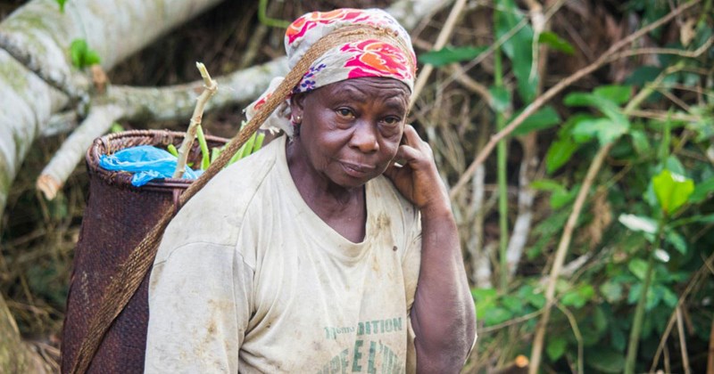 Aunt living in poverty wearing a head scarf looking at the camera