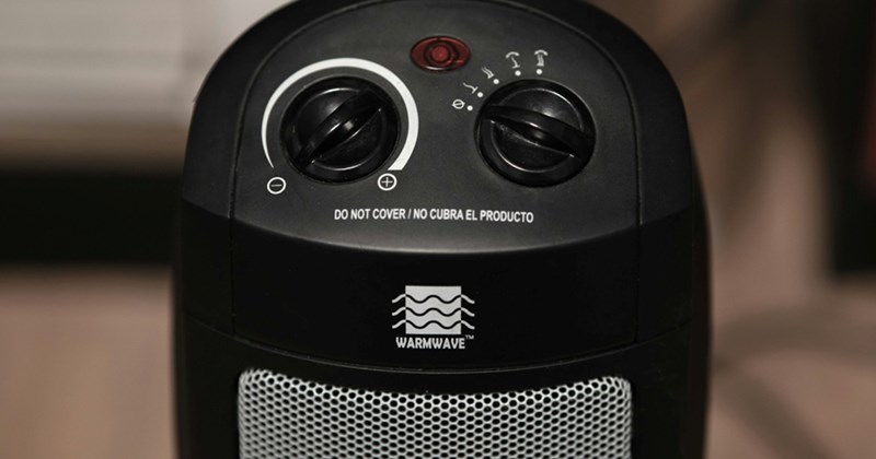 Close-up of a control panel on a switched-off space heater