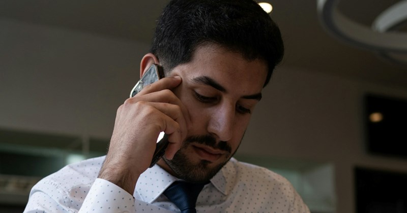 A businessman talks on his cell phone
