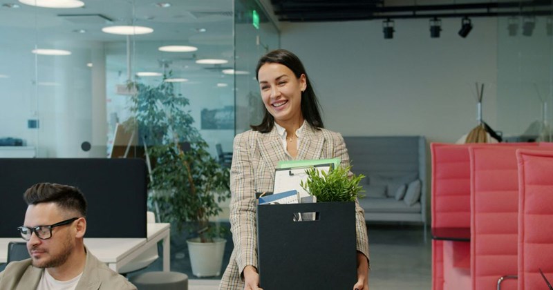 Happy woman leaves her old job, confident that her new business will make her a millionaire in two years. 