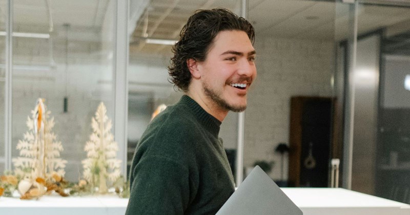 An overly confident young employee strolls into a meeting to ask his boss for a 50% raise.