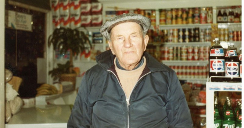 Old man in grocery store criticizing employee for the dirty bathrooms