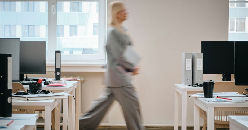 A woman running out of her office