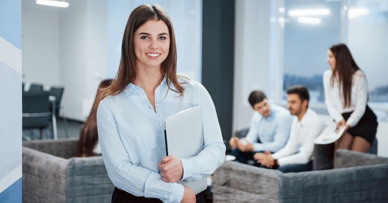 A young employee at a tech company, who doesn't yet know that her boss knows what she posted about her on social media.