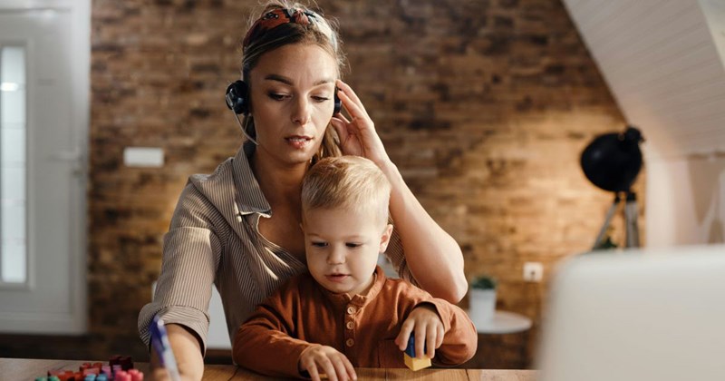 A mom of a toddler is working part-time while managing household duties.