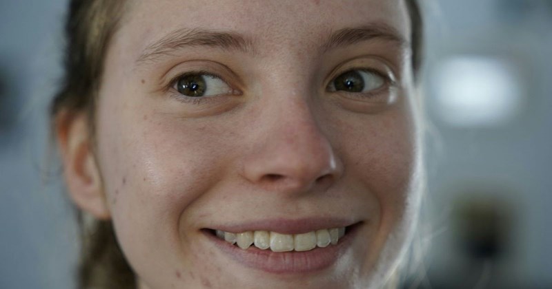 A bare-faced young woman who doesn't feel like she has to wear makeup to go to her job as a teaching assistant, especially considering that her school forbids students from wearing makeup. 