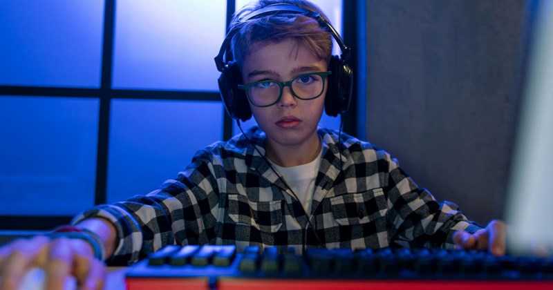 A 13-year-old boy playing video games.