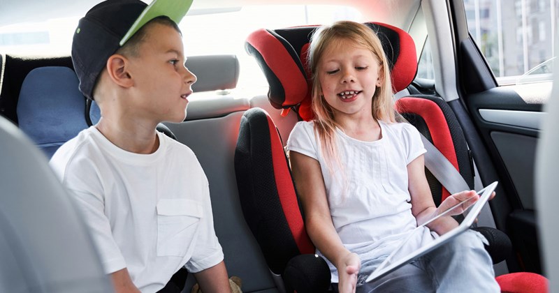   Title Description Niece and nephew in the backseat of their aunt's car after school.