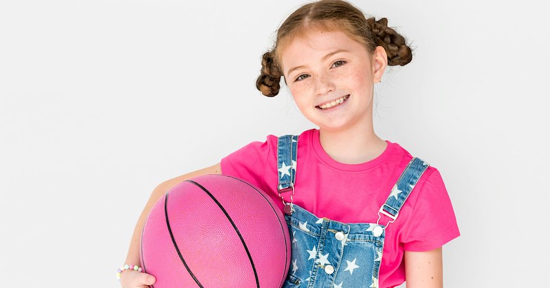 A little girl with a basketball