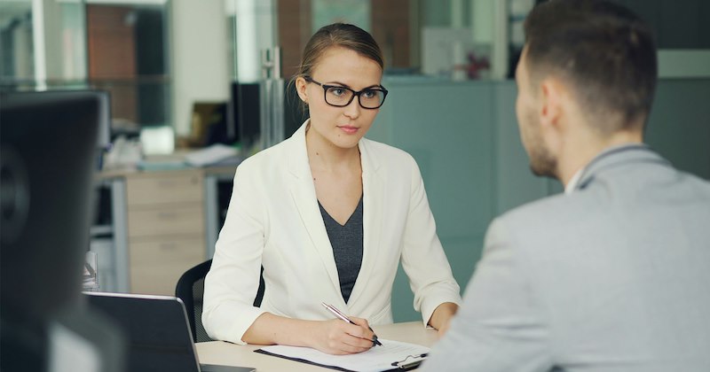 A woman conducting a job interview