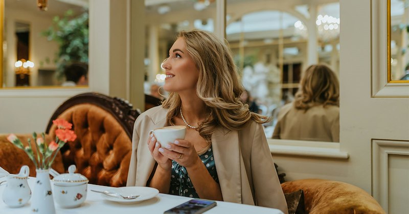 A wealthy woman drinking coffee 